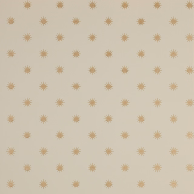 Warm cream wallpaper with evenly spaced muted ochre sunburst motifs