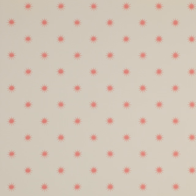 Cream wallpaper with evenly spaced muted red radial flower motifs