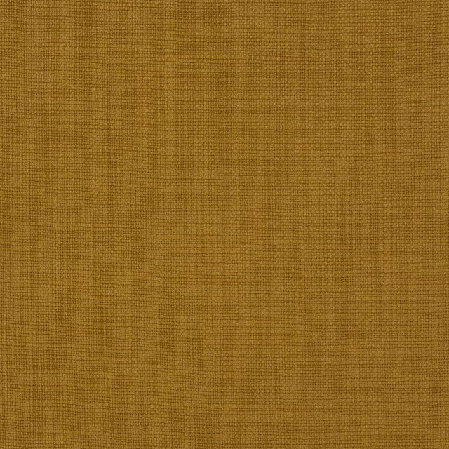 Close-up of a muted saffron-gold plain weave linen fabric