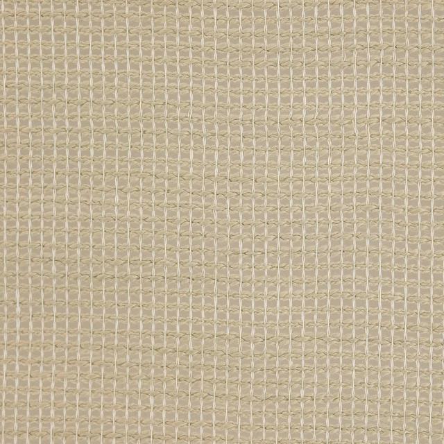 Close-up of warm beige woven fabric with a small grid texture