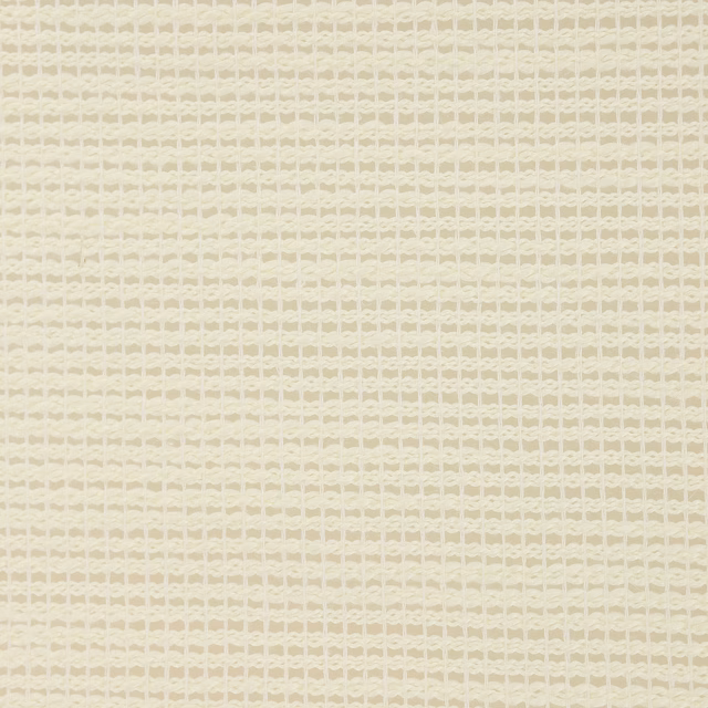 Close-up of a soft cream woven fabric with a small geometric texture