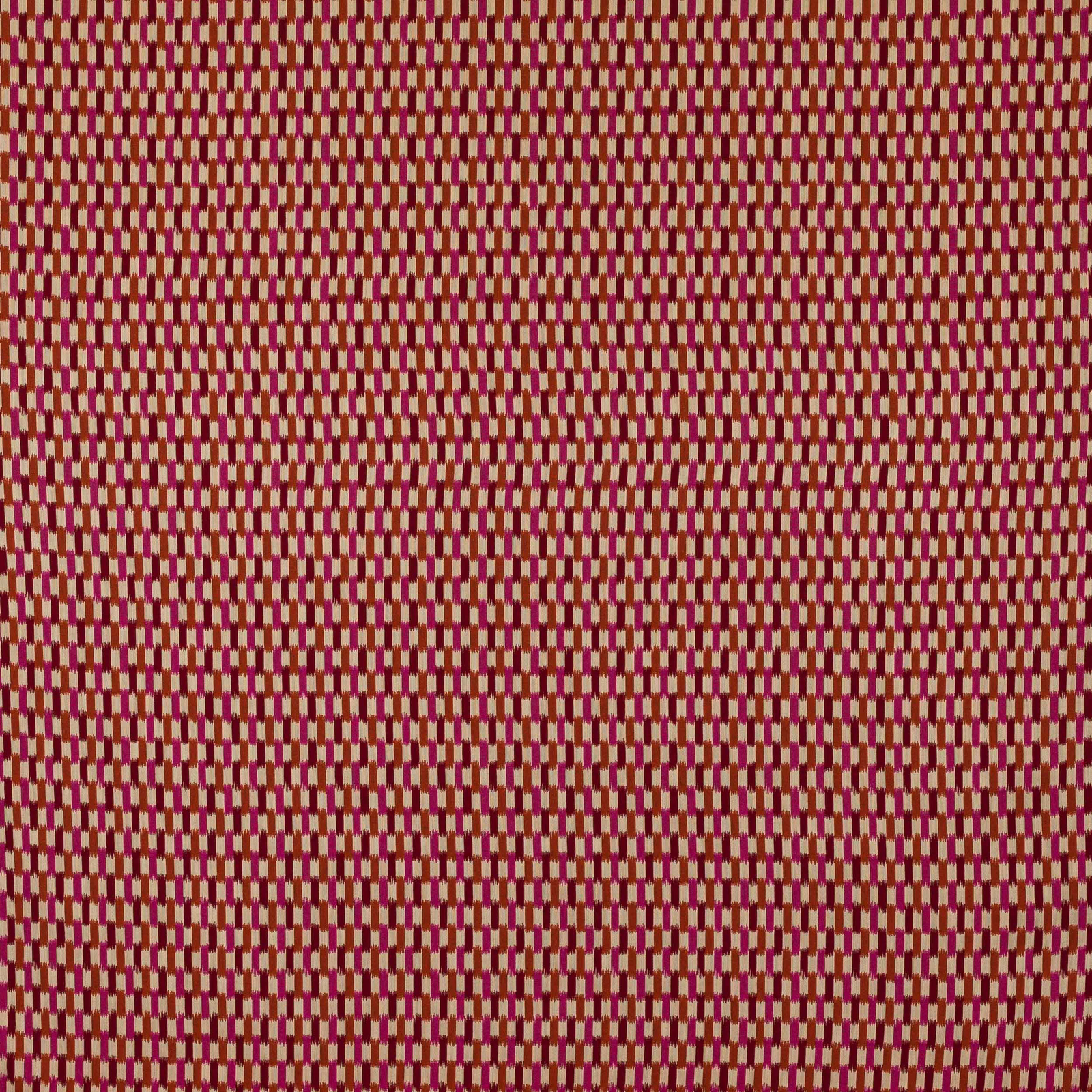 Close-up of small geometric fabric in vivid fuchsia, rose and burgundy tones