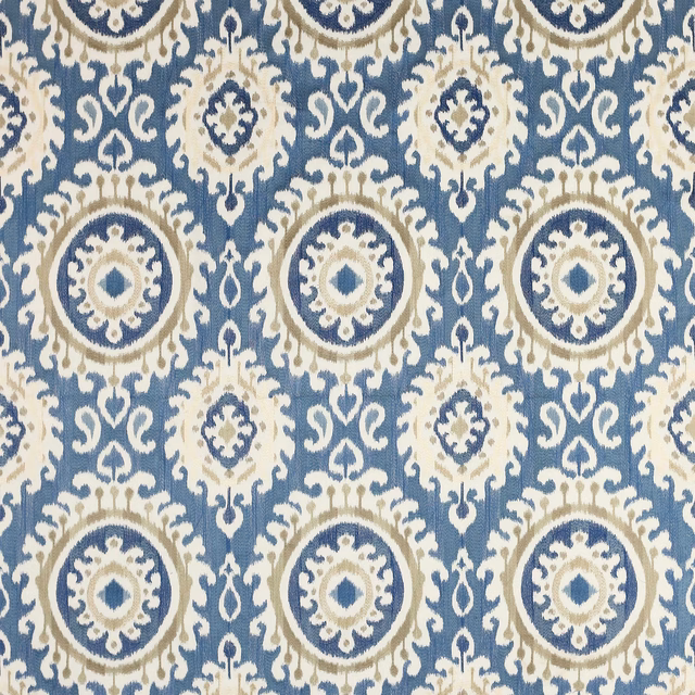 Blue and ivory geometric fabric with large circular medallions and woven texture