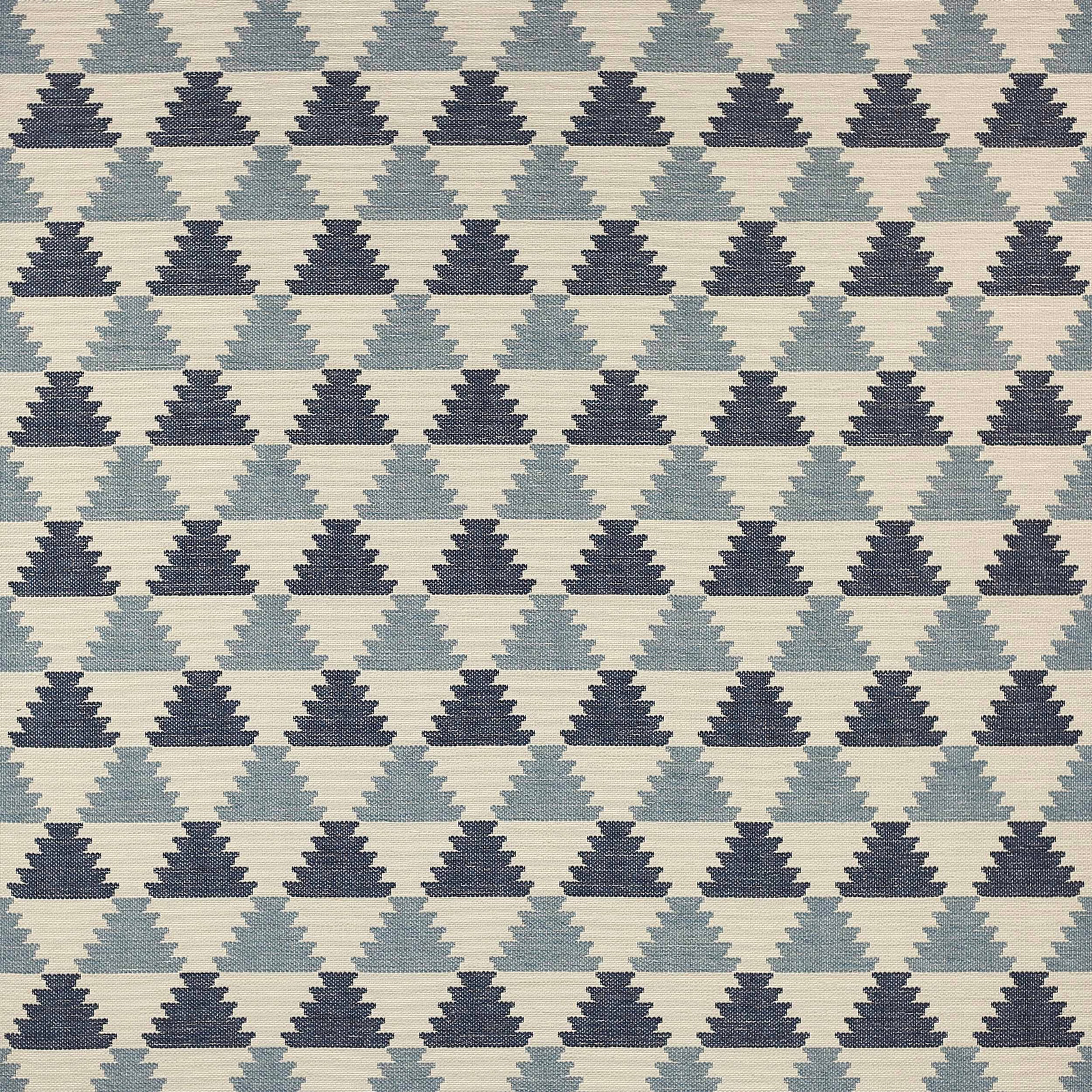 Geometric woven fabric with stepped triangle motifs in pale blue and navy on a light ground
