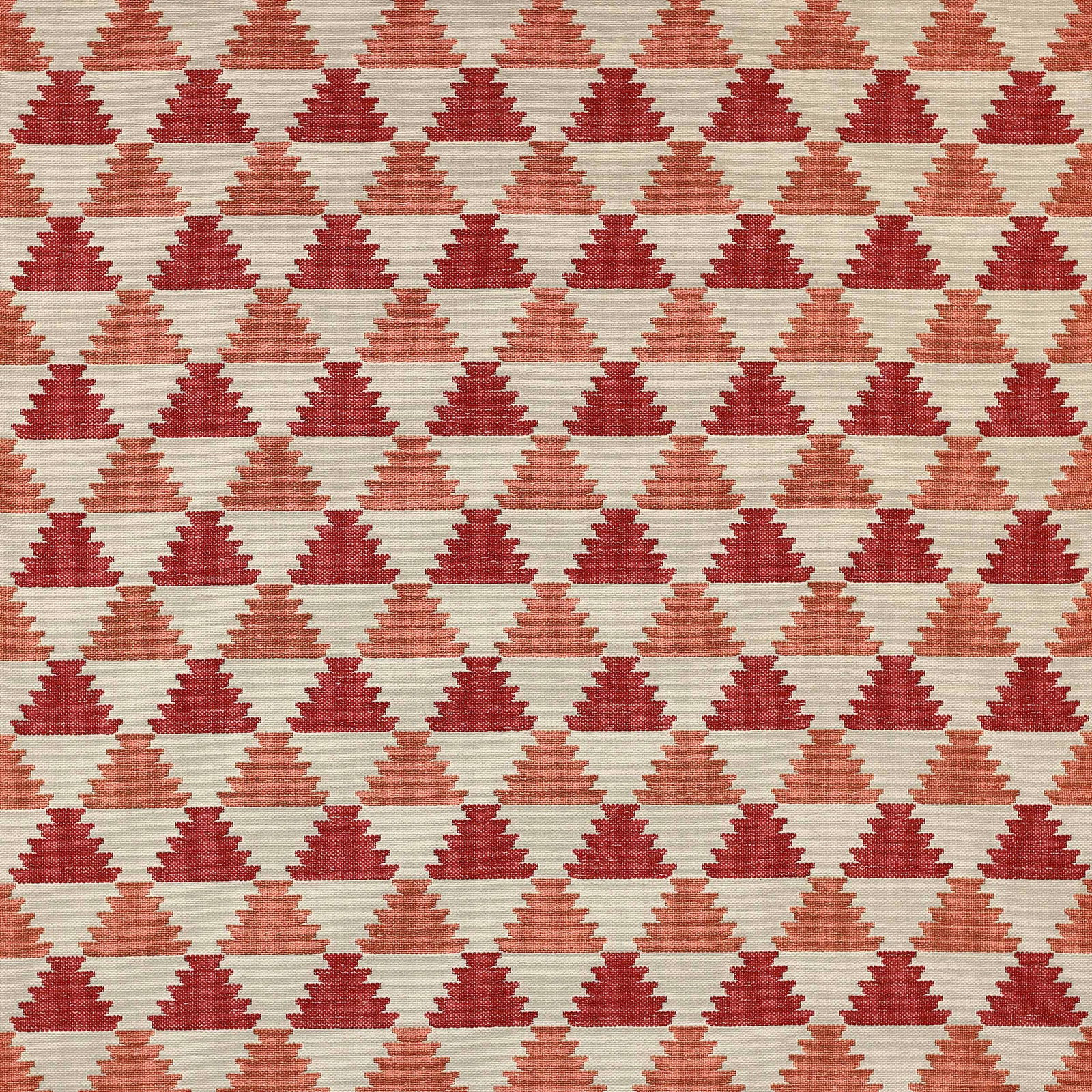Geometric woven fabric with stepped triangles in red and red-orange on a pale ground