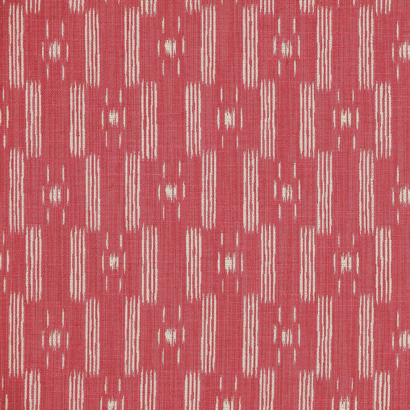 Coral red geometric woven fabric with pale ikat-style vertical motifs