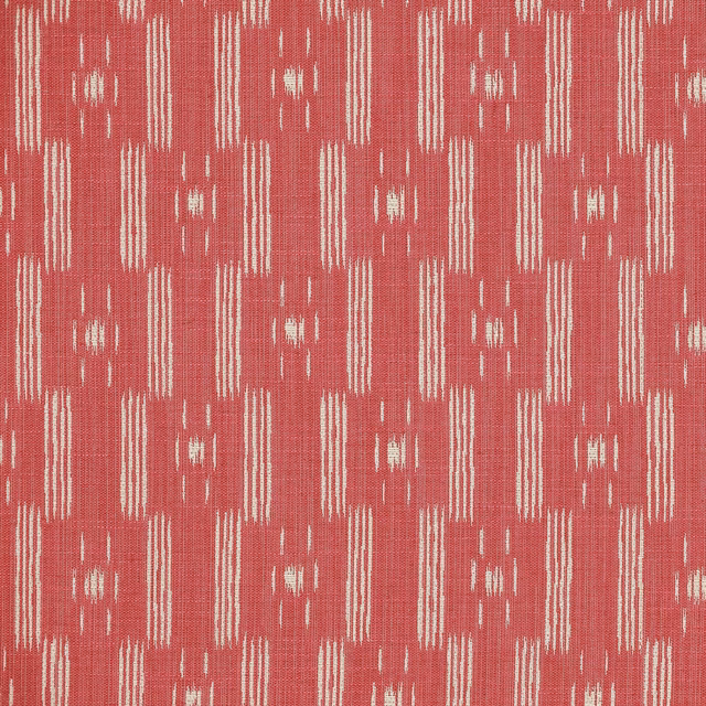 Coral red geometric woven fabric with pale ikat-style vertical motifs