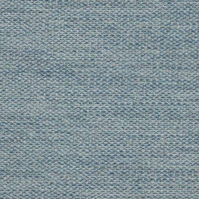 Close-up of a softly textured blue woven fabric with speckled pale highlights