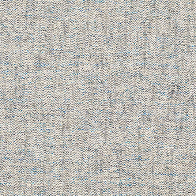 Close-up of slate blue woven fabric with fine herringbone texture and pale flecks