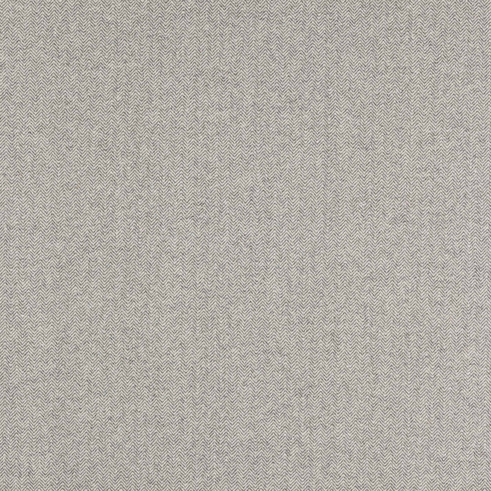 Close-up of a soft graphite grey herringbone fabric with fine woven texture