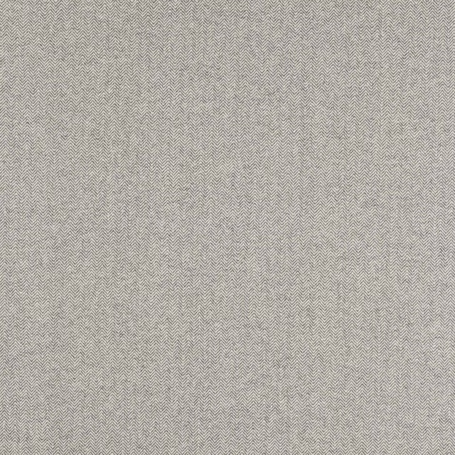 Close-up of a soft graphite grey herringbone fabric with fine woven texture