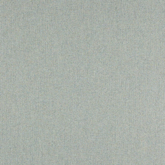 Close-up of soft jade green herringbone weave fabric with fine texture