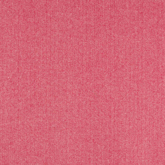 Close-up of warm raspberry-red herringbone fabric with fine woven texture