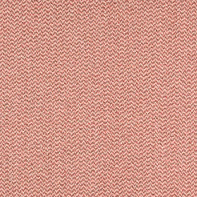 Close-up of soft tomato coral herringbone woven fabric