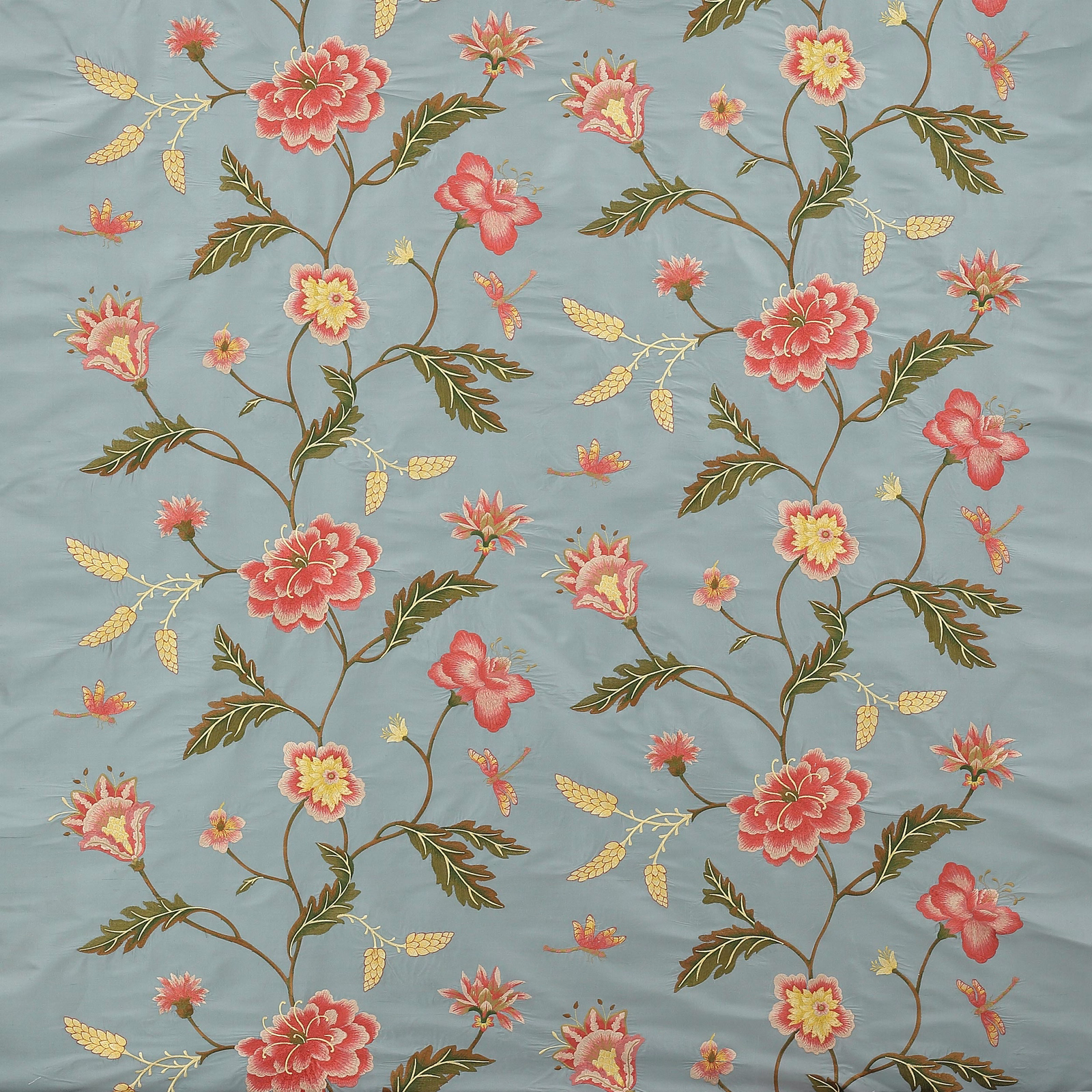 Blue floral fabric with coral blossoms, olive stems and small yellow accents