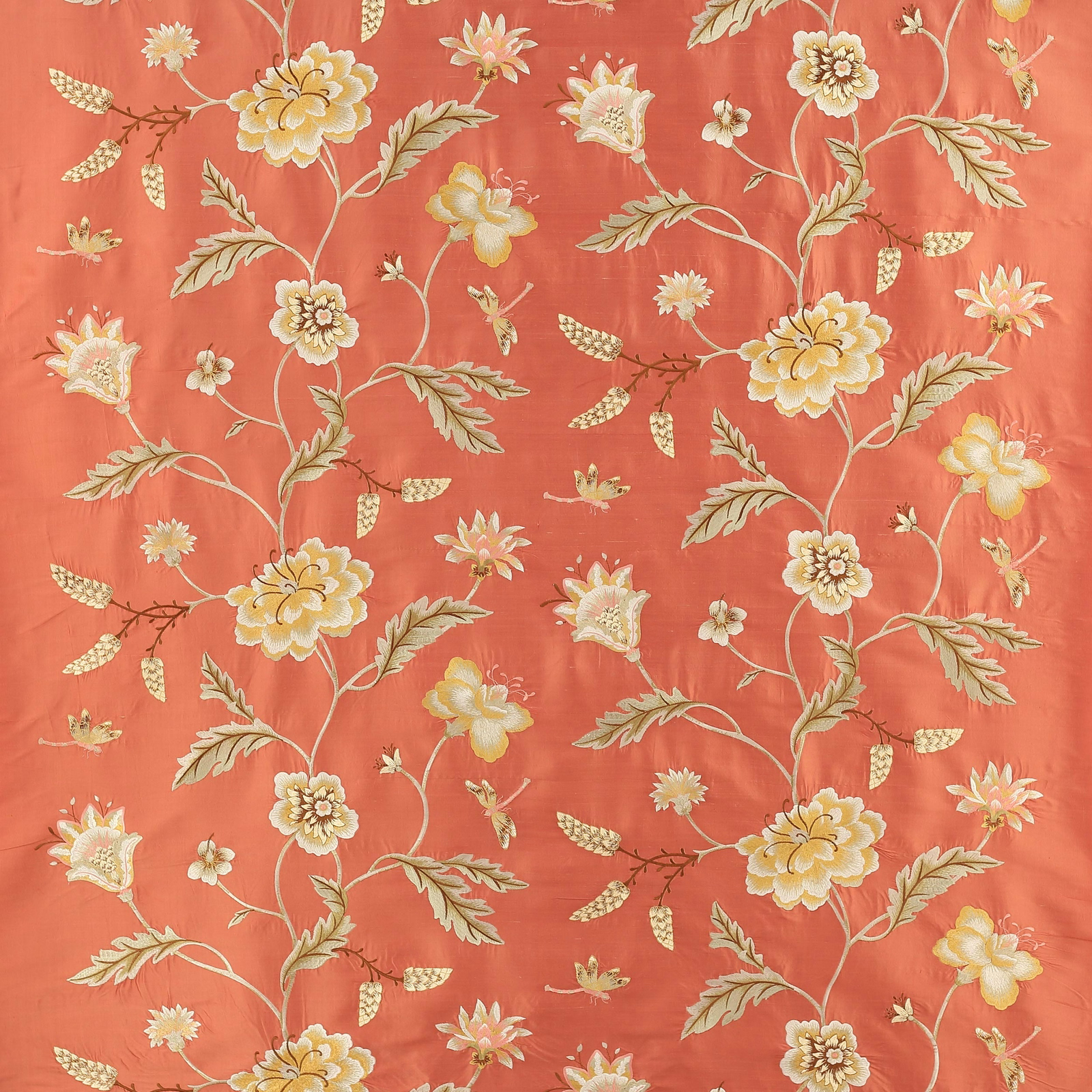 Coral-red floral silk fabric with cream and yellow blossoms and trailing stems