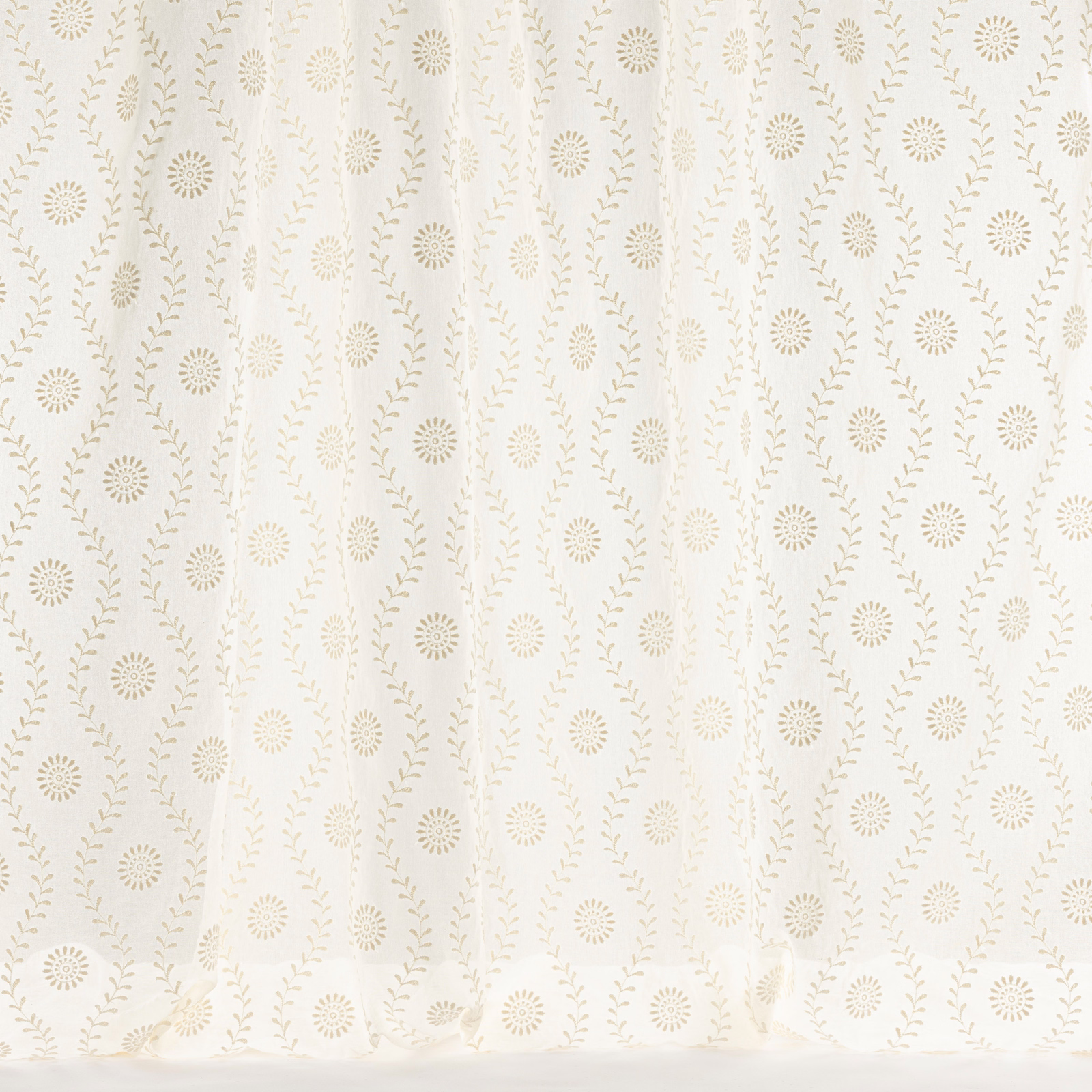 Cream woven fabric with small floral motifs and trailing leaf vines