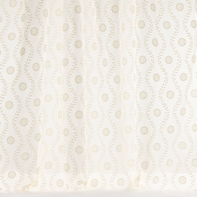 Cream woven fabric with small floral motifs and trailing leaf vines