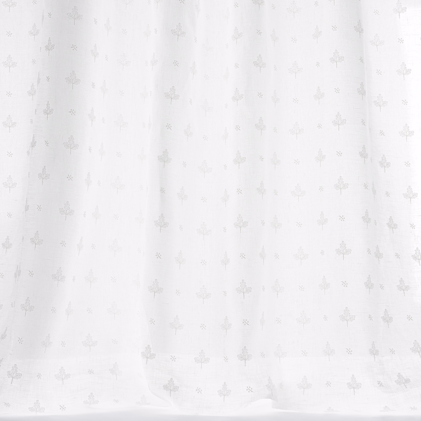 Pale ivory fabric with a small tonal floral repeat and soft woven texture