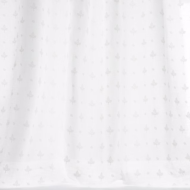 Pale ivory fabric with a small tonal floral repeat and soft woven texture