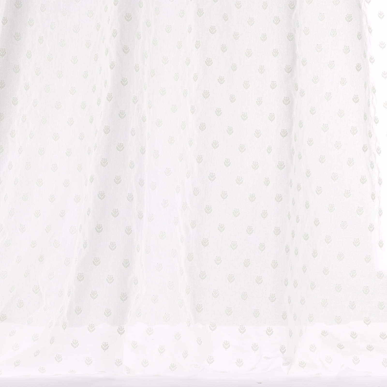 Pale ivory cotton fabric with tiny tonal repeating motif and soft drape