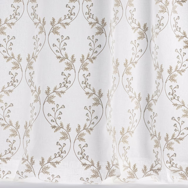 Sheer ivory fabric with scrolling vine embroidery in soft beige and taupe