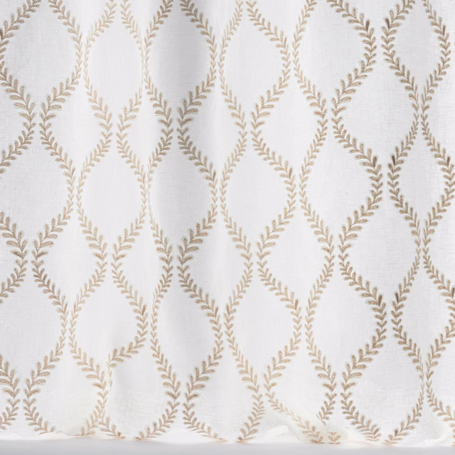 Ivory woven fabric with warm taupe leaf lattice embroidery