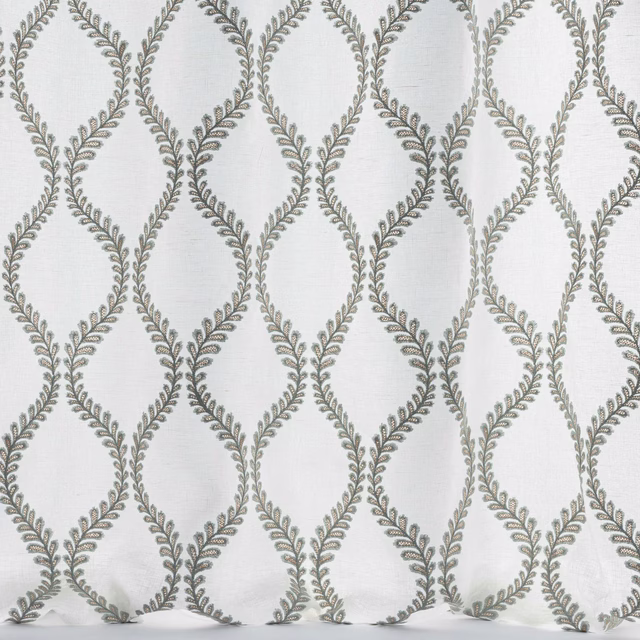 Pale blue-grey woven fabric with repeating leaf lattice trellis motif