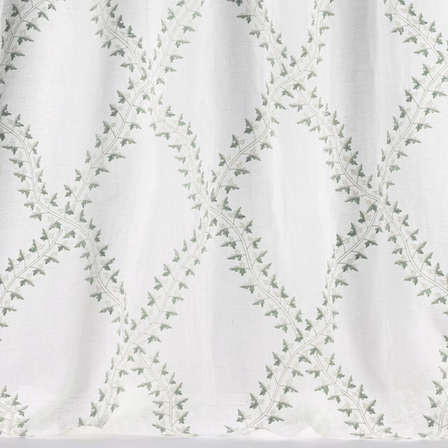 Pale old blue trellis fabric with tiny leaf sprigs on a light ground