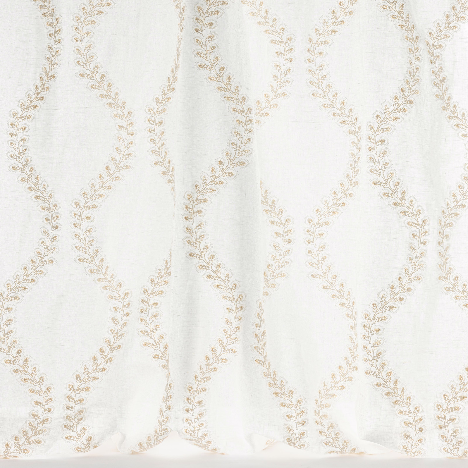 Ivory fabric with pale gold looping leaf trellis pattern