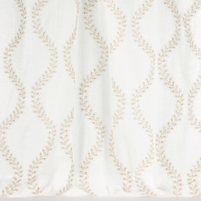 Ivory fabric with pale gold looping leaf trellis pattern