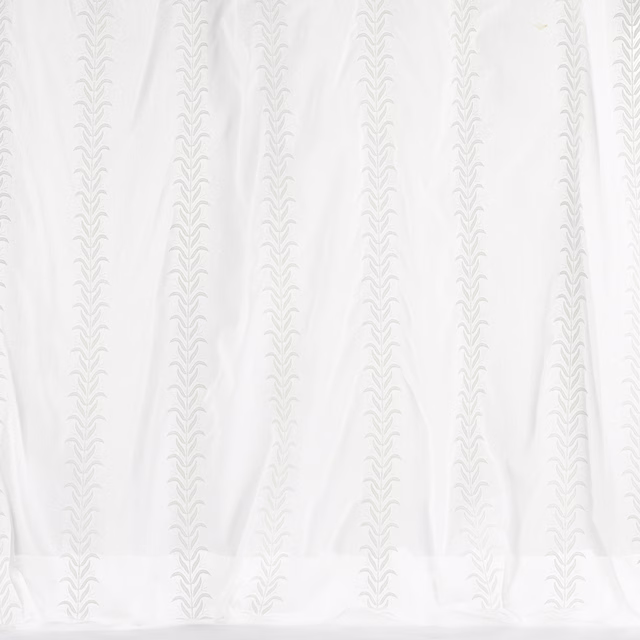 Pale ivory cotton fabric with narrow vertical decorative stripe repeat