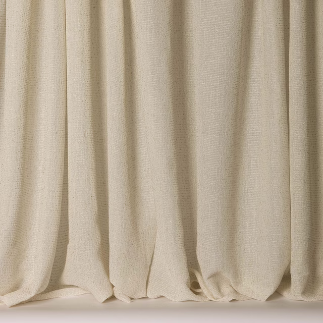 Soft ivory textured fabric hanging in gentle vertical folds, wide width sample