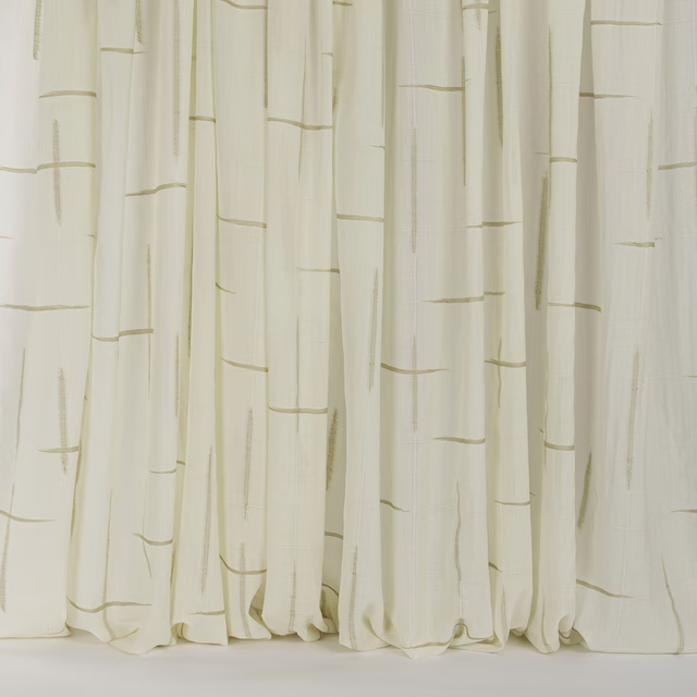 Cream wool curtain fabric with fine sand-coloured linear marks and soft folds