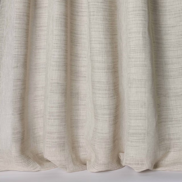 Soft ivory linen fabric with fine slubbed texture and gentle drape