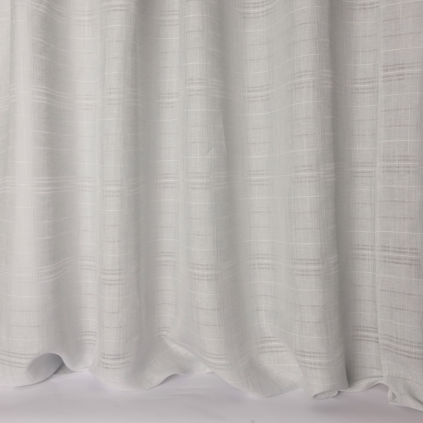 Pale icy blue-grey linen-look fabric draped in soft vertical folds
