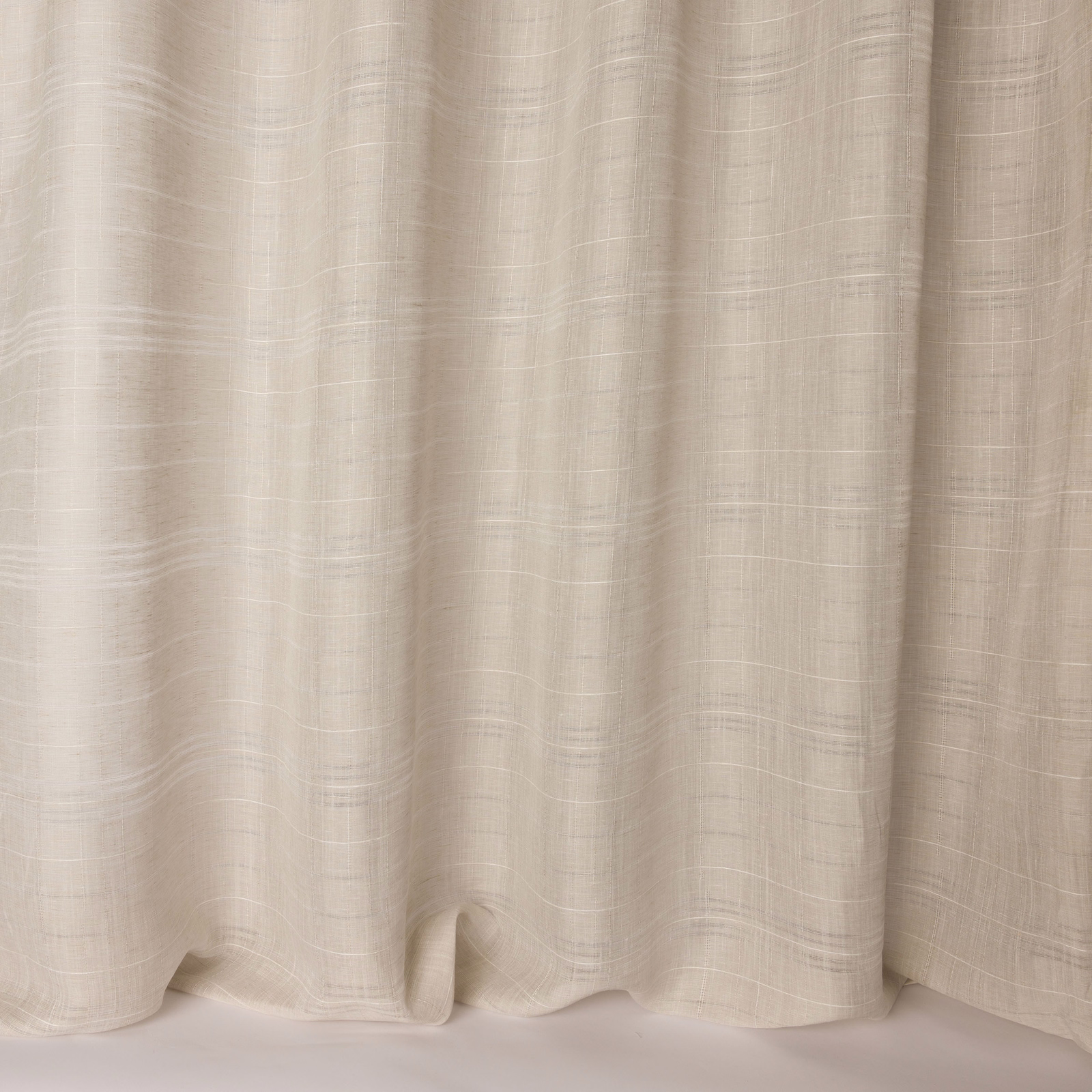 Cream linen-textured fabric with soft woven striations and fluid drape