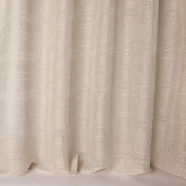 Cream linen-textured fabric with soft woven striations and fluid drape