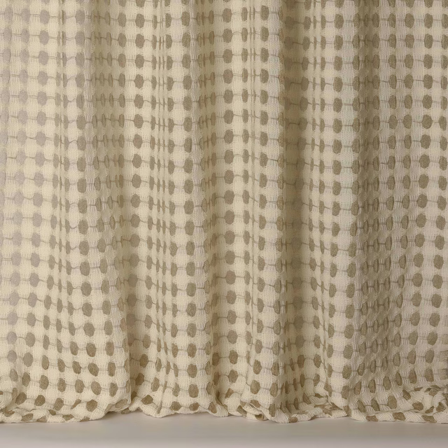 Soft gold-beige woven fabric with small dotted pattern and subtle folds