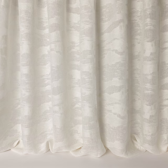 Ivory cream fabric with subtle abstract tonal pattern and soft linen texture