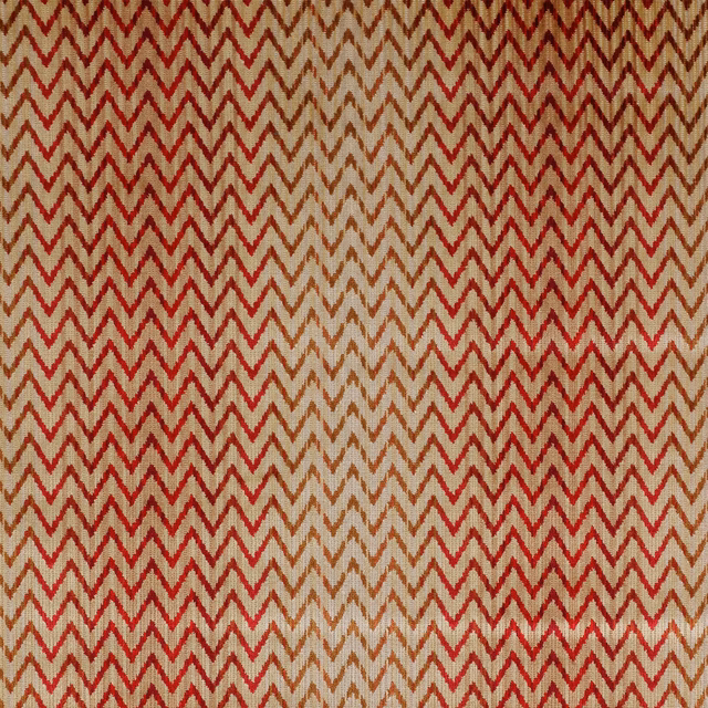 Red and beige chevron velvet fabric swatch with a soft pile