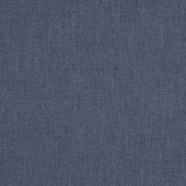 Close-up of muted denim blue woven fabric with fine textured surface