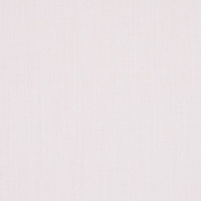Close-up of a soft warm white plain-woven fabric with fine linen texture
