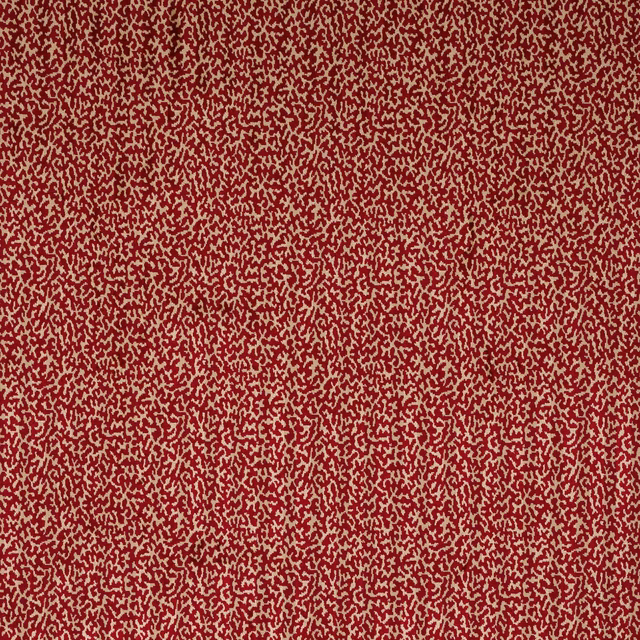 Close-up of deep scarlet abstract velvet with cream flecks and soft pile