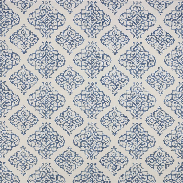 Blue ornamental lattice print on a pale cotton ground, shown as a fabric swatch
