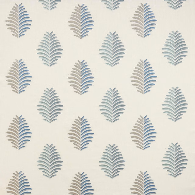 Pale ground fabric with repeating blue and sage leaf motifs