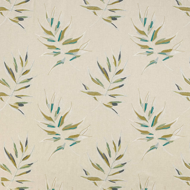 Cream botanical fabric with green, teal and olive leaf sprays on a woven ground