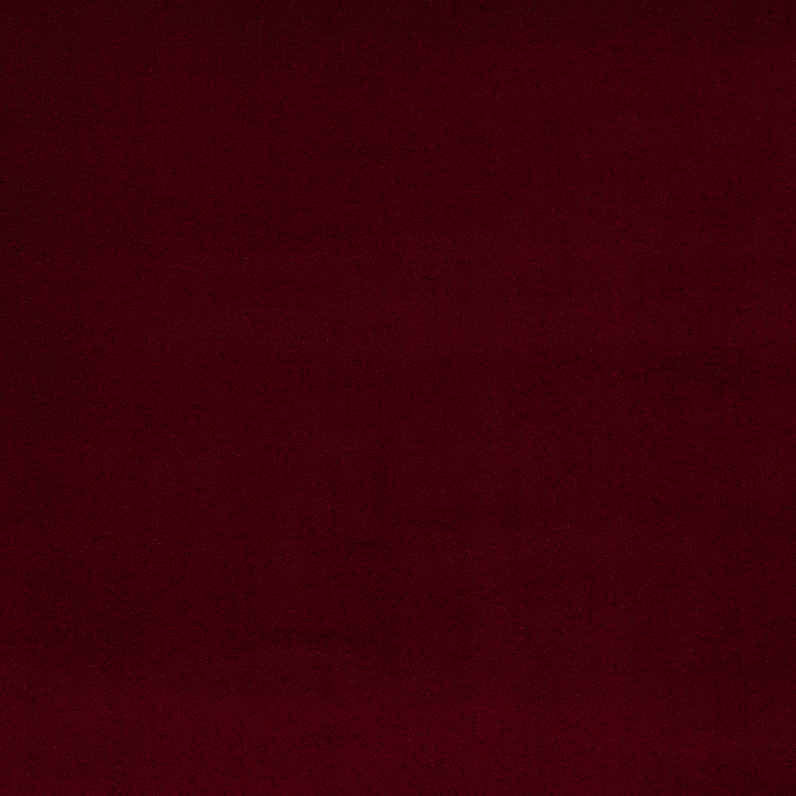 Deep burgundy plain fabric swatch with a smooth, velvety-looking finish