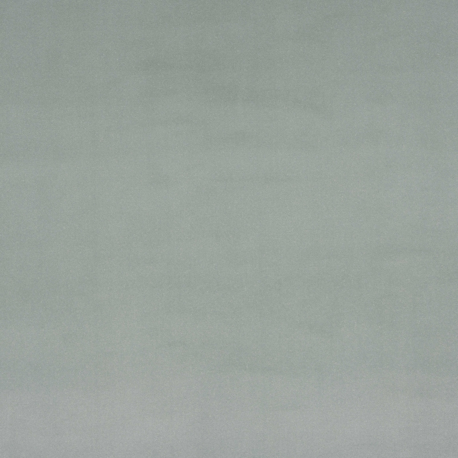 Soft celadon green plain fabric with a smooth, matte finish