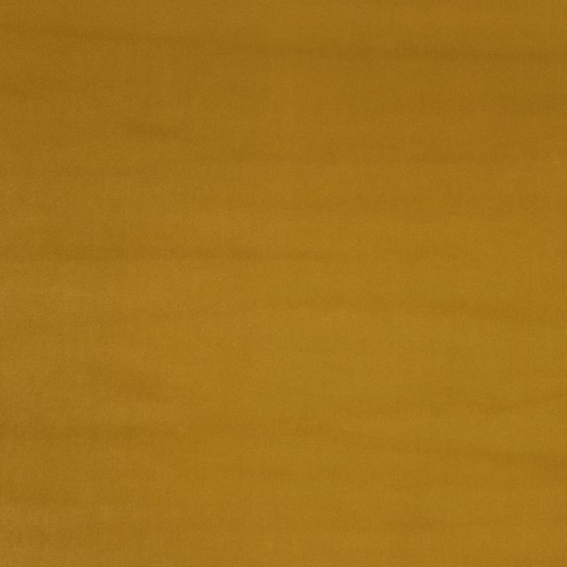 Mustard gold plain fabric swatch with a smooth matte surface